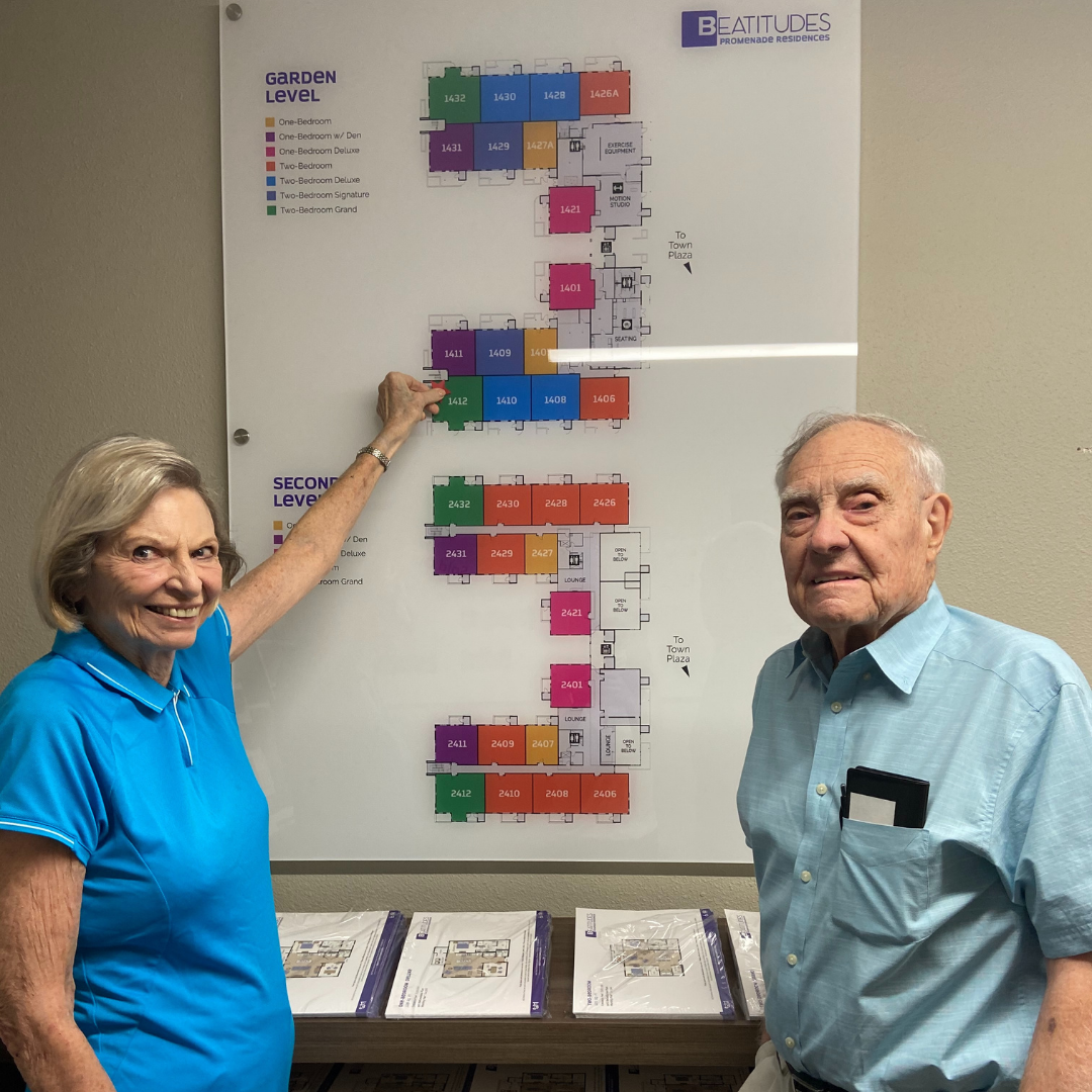 Marta and Tom Brooks with a map of their new residence