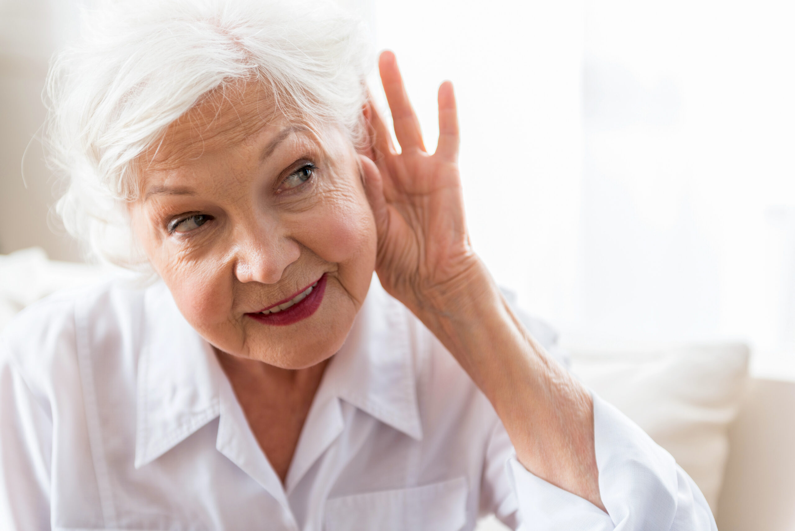 elderly lady having hearing problem